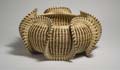 Round basket decorated with loops of upraised trim (Smithsonian Institution) 