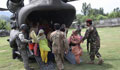 Group of people leaving helicopter (DOD)