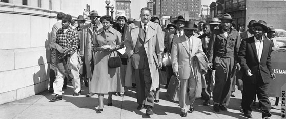 Thurgood Marshall walks with a group of people in 1956 (AP Images)
