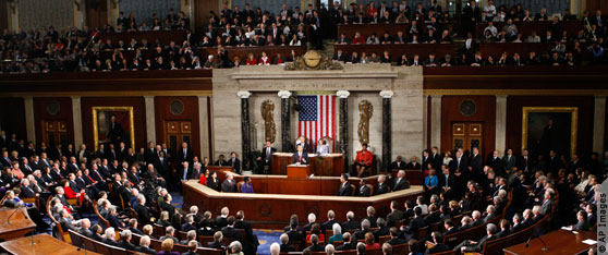 Wide view of Obama at podium inside U.S. Capitol delivering State of the Union address (AP Images)