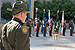 A CBP Border Patrol agent and the CBP Honor Guard await the start of the Valor Memorial Wreath Laying Ceremony during National Police Week in Washington, D.C.