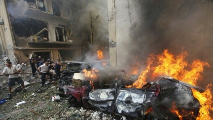 Date: 10/19/2012 Description: Lebanese firefighters extinguish burning cars at the scene of an explosion in the mostly Christian neighborhood of Achrafiyeh, Beirut, Lebanon, Friday Oct. 19, 2012. Lebanon's state-run news agency says a massive blast in east Beirut was caused by a car bomb and that there are casualties. (AP Photo/Hussein Malla) © AP Image