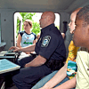 CBP officer shows students images on x-ray equipment.