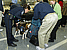  A member of the CBP Beagle Brigade stops to investigate an arriving passenger's luggage looking for prohibited agricultural products or meats.