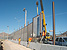 Cerrudo Services construction workers assemble fence in El Paso.