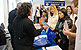 A CBP import specialist manager answers questions during CBP's National Career Day in Chicago.