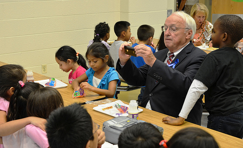 Under Secretary Kevin Concannon takes a photo of his lunch mates last month at Arcola Elementary School in Silver Spring, Md.  Concannon presented all 132 Montgomery County Elementary Schools with Healthier US Schools Challenge Bronze awards.