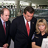 DHS Secretary Tom Ridge and CBP Commissioner Robert C. Bonner listen to a CBP officer explain entry procedures during the announcement of a major initiative to present 'One Face at the Border' and the new unified CBP officer of the future.