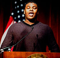 Photo: Johnathan Walker sings the National Anthem during the National Hispanic Heritage Month Program