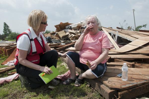 Donna Wood, a Red Cross worker talks to a resident of Denning, Ark.