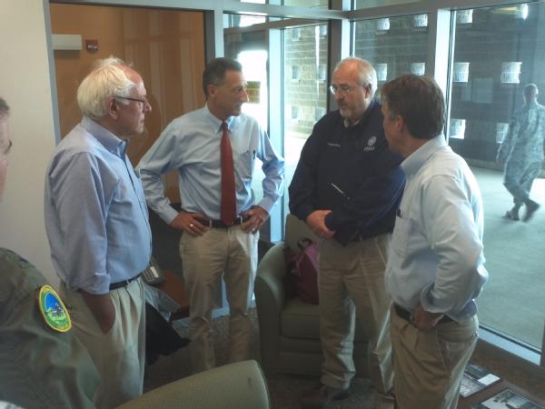 Administrator Craig Fugate (second from right) meets with Peter Shumlin (second from left), Governor of Vermont, during a visit to meet with local officials and survey damages caused by Irene.