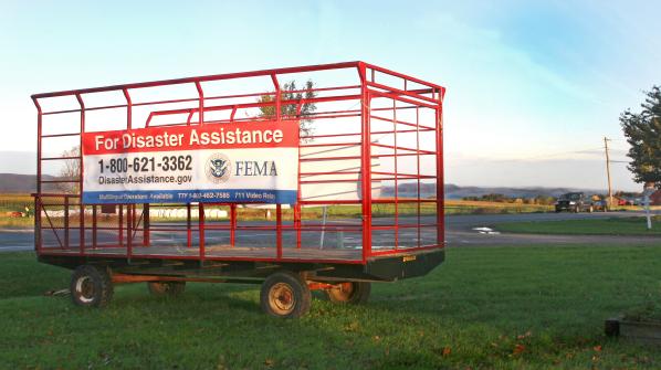 Charlotte, VT, October 16, 2011 -- A mobile hay wagon displays FEMA's disaster assistance information on Route 7 in Charlotte, Vermont. The Vermont Farm Bureau and FEMA are working together to encourage those affected by Tropical Storm Irene to register by the October 31st deadline.