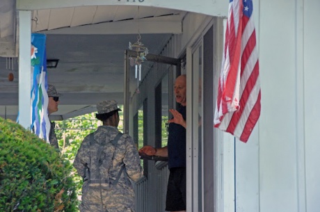 Columbus, Ohio, July 2, 2012 -- Pvt. Jason Geier (left) and Sgt. Jessica Cooper, of Headquarters and Headquarters Company, 216th Engineer Battalion, talk with Gary Rowe, of Columbus, Ohio, on July 2, 2012. (Ohio National Guard photo by Senior Airman Jordyn Sadowski) 