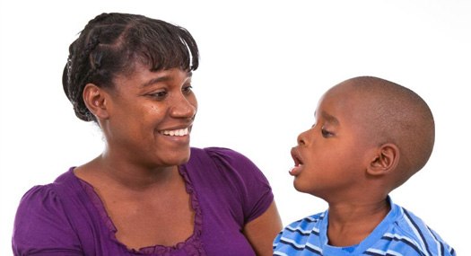 woman smiling at son who is visually impaired