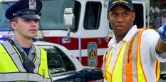 Fireman and policeman at scene of highway emergency