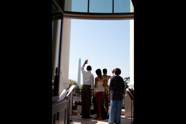 President Barack Obama And First Lady Michelle Obama Wave To The Crowd