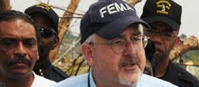 FEMA Administrator Craig Fugate answers questions at a press conference in tornado damaged Pratt City, AL.