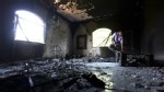 PHOTO: A Libyan man investigates the inside of the  U.S. Consulate, after an attack that killed four Americans, including Ambassador Chris Stevens on the night of Tuesday, Sept. 11, 2012, in Benghazi, Libya, in this Sept. 13, 2012 photo.