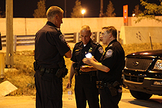 Director Field Operations for Detroit, Christopher Perry talks with his APD-Tactical John Nowak and Port Director Roderick Blanchard before the bomb sniffing dogs are sent in to search the bridge. 