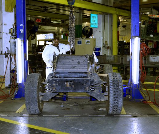 A Red River Army Depot employee works to disassemble a High Mobility Multipurpose Wheeled Vehicle. The Humvee facility is able to produce over 40 vehicles per day.