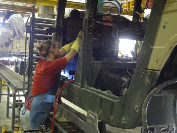 An employee of Red River Army Depot works to rebuild a High Mobility Multipurpose Wheeled Vehicle. RRAD is designated as the Secretary of the Army Center of Industrial and Technical Excellence for the Humvee as well as other tactical and combat vehicles.