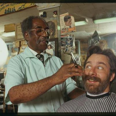 Photo: Will he or won't he?  In honor of "No Beard Day," just one of the wacky holidays celebrated on October 18, here is a photo of Louis McDowell preparing to give AFC fieldworker David Taylor a shave during our Working in Paterson fieldwork project in 1994.  Strangely, Taylor still has a beard to this day.

October 18 is also Chocolate Cupcake Day.  Enjoy!