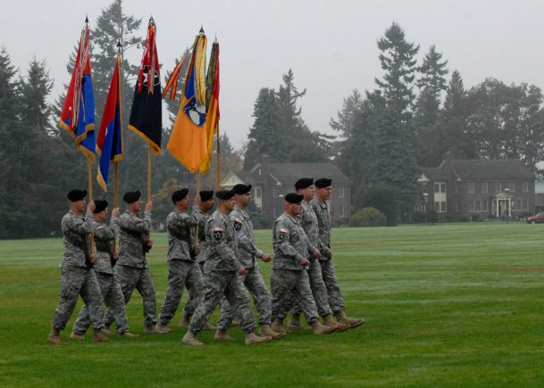 Soldiers carry the unit colors of (from left to right) 2nd Stryker Brigade Combat Team, 2nd Infantry Division; 3rd SBCT, 2nd Inf. Div.; 4th SBCT, 2nd Inf. Div.; 16th Combat Aviation Brigade; and 17th Fires Brigade, during the reactivation ceremony of the 7th Infantry Division "Bayonets," Oct. 10, 2012, at Joint Base Lewis-McChord, Wash. The 7th Inf. Div. will now be the higher headquarters for each of these brigades, which total nearly 18,000 Soldiers.