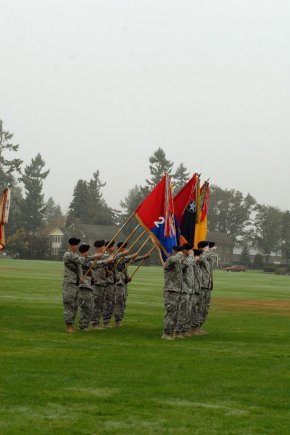 Soldiers "present arms" with the unit colors of, from left to right, 2nd Stryker Brigade Combat Team, 2nd Infantry Division; 3rd SBCT, 2nd Inf. Div.; 4th SBCT, 2nd Inf. Div.; 16th Combat Aviation Brigade; and 17th Fires Brigade, during the reactivation ceremony of the 7th Infantry Division "Bayonets," Oct. 10, 2012, at Joint Base Lewis-McChord, Wash. The 7th Inf. Div. will now be the higher headquarters for each of these brigades, which total nearly 18,000 Soldiers.