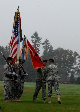 Command Sgt. Maj. Delbert D. Byers, left, accepts the colors from Maj. Gen. Stephen R. Lanza, Oct. 10, 2012, during the 7th Infantry Division reactivation ceremony at Watkins Parade Field, Joint Base Lewis-McChord, Wash. Lanza and Byers will lead the division and its five subordinate brigades, which consist of nearly 18,000 soldiers. The brigades are as follows: 2nd Stryker Brigade Combat Team, 2nd Infantry Division; 3rd SBCT, 2ID; 4th SBCT, 2ID; 16th Combat Aviation Brigade; and 17th Fires Brigade.