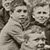detail of children looking back at the camera