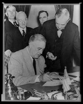President Roosevelt signing the declaration of war against Japan