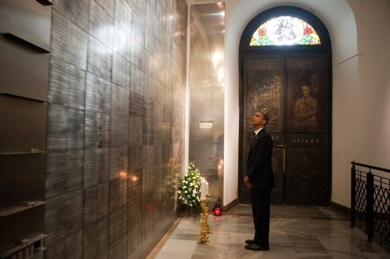 President Barack Obama pays his respects while visiting the memorial to the victims of the Smolensk 