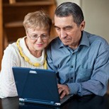 a couple using a laptop