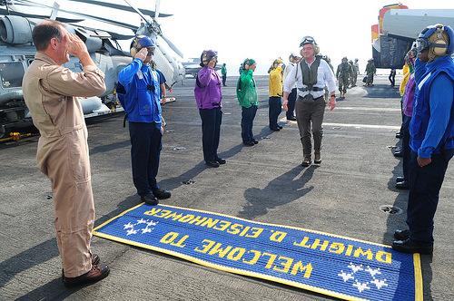 <p>U.S. Navy Rear Adm. Michael Manazir, left, the commander of Carrier Strike Group (CSG) 8, salutes Deputy Secretary of Defense Aston B. Carter, center, upon Carter's arrival aboard aircraft carrier USS Dwight D. Eisenhower (CVN 69) in the Persian Gulf Oct. 19, 2012. Carter was on a seven-day trip to the Middle East to meet with leadership in the region. (DoD photo by Mass Communication Specialist 2nd Class Julia Casper, U.S. Navy/Released)</p>