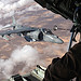 <p>A U.S. Marine watches from a KC-130J Hercules aircraft as an AV-8B Harrier aircraft assigned to Marine Aviation Weapons and Tactics Squadron 1 is refueled over Yuma, Ariz., Oct. 11, 2012. (DoD photo by Capt. Staci Reidinger, U.S. Marine Corps/Released)</p>