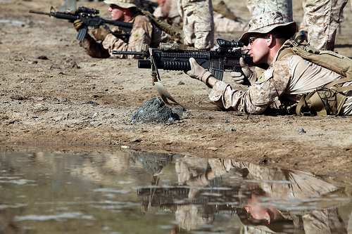 <p>U.S. Marines with Bravo Company, Battalion Landing Team, 1st Battalion, 2nd Marine Regiment, 24th Marine Expeditionary Unit (MEU) fire M4 carbines during a battle sight zero shooting range in Djibouti, Djibouti, Oct. 1, 2012. The training was part of a three-week exercise comprising basic infantry skills and desert survival techniques. The 24th MEU was deployed with the Iwo Jima Amphibious Ready Group as a theater reserve and crisis response force in U.S. Central Command and the U.S. Navy's 5th Fleet area of responsibility. (DoD photo by Staff Sgt. Robert Fisher, U.S. Marine Corps/Released)</p>