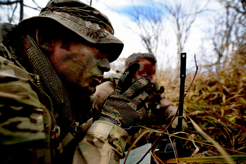 <p>U.S. Air Force Tech. Sgt. Bobby Colliton and Staff Sgt. Dane Hatley conduct combat survival training near Osan Air Base, South Korea, during Exercise 2012 Pacific Thunder on Oct. 15, 2012.   Colliton is a survival evasion resistance and escape specialist from the 18th Operation Support Squadron at Kadena Air Base, Japan, and Hatley is a 33rd Rescue Squadron flight engineer. (DoD photo by Staff Sgt. Sara Csurilla, U.S. Air Force/Released)</p>