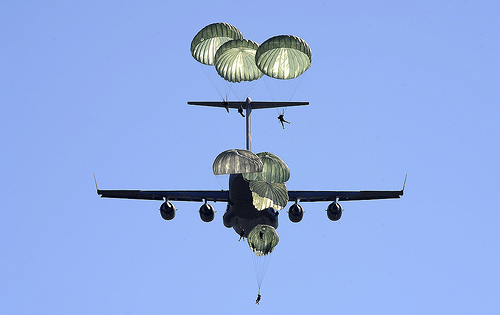<p>U.S. Soldiers with the 82nd Airborne Division jump from an Air Force C-17 Globemaster III aircraft during Large Package Week/Joint Operational Access Exercise (LPW/JOAX) 13-01 Oct. 11, 2012, at Fort Bragg, N.C. LPW/JOAX is a joint Army and Air Force training exercise held several times a year to practice large-scale airdrop missions for personnel and equipment. (DoD photo by Master Sgt. Joanna Hensley, U.S. Air Force/Released)</p>