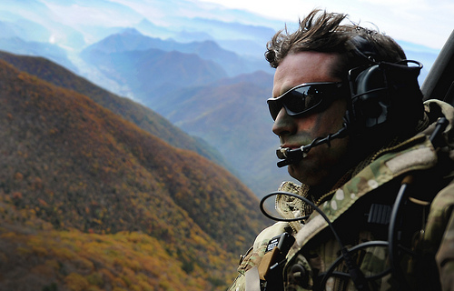 <p>U.S. Air Force Tech. Sgt. Bobby Colliton, assigned to the 18th Operation Support Squadron, rides in an HH-60 Pave Hawk helicopter near Osan Air Base, South Korea, Oct. 10, 2012, during exercise Pacific Thunder 2012. Pacific Thunder is an annual two-week exercise that involves the 33rd and 31st Rescue Squadrons from Kadena Air Base, Japan, and the 25th Fighter Squadron from Osan Air Force Base. (DoD photo by Staff Sgt. Sara Csurilla, U.S. Air Force/Released)</p>