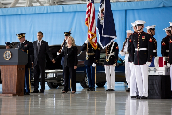 President Barack Obama stands with Secretary of State Hillary Rodham Clinton during the transfer of remains ceremony
