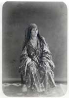 Khimet-Ai, a gracious Uzbek woman of obvious wealth, poses for the camera's approving lens