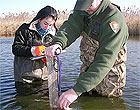 Park ranger and intern taking water quality samples