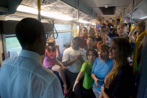 President Obama Talks with Audience Members on a Bus on Memorial Day