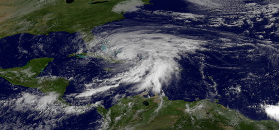 satellite view of hurricane-swirling clouds above earth