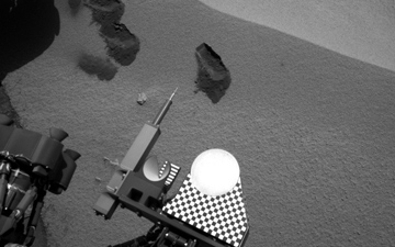 Three bite marks left in the Martian ground by the scoop on the robotic arm of NASA's Mars rover Curiosity are visible in this image taken by the rover's right Navigation Camera during the mission's 69th Martian day, or sol (Oct. 15, 2012).