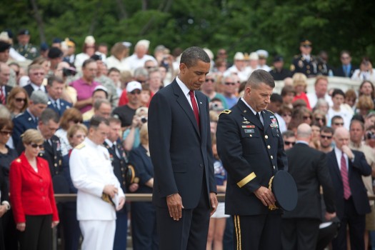 President Barack Obama bows his head for a moment of silence at the Tomb of the Unknown Soldier at Arlington National Cemetery
