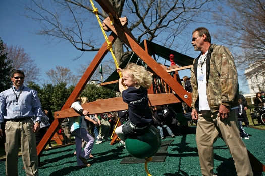 The Children’s Miracle Network Champions play on the White House swingset
