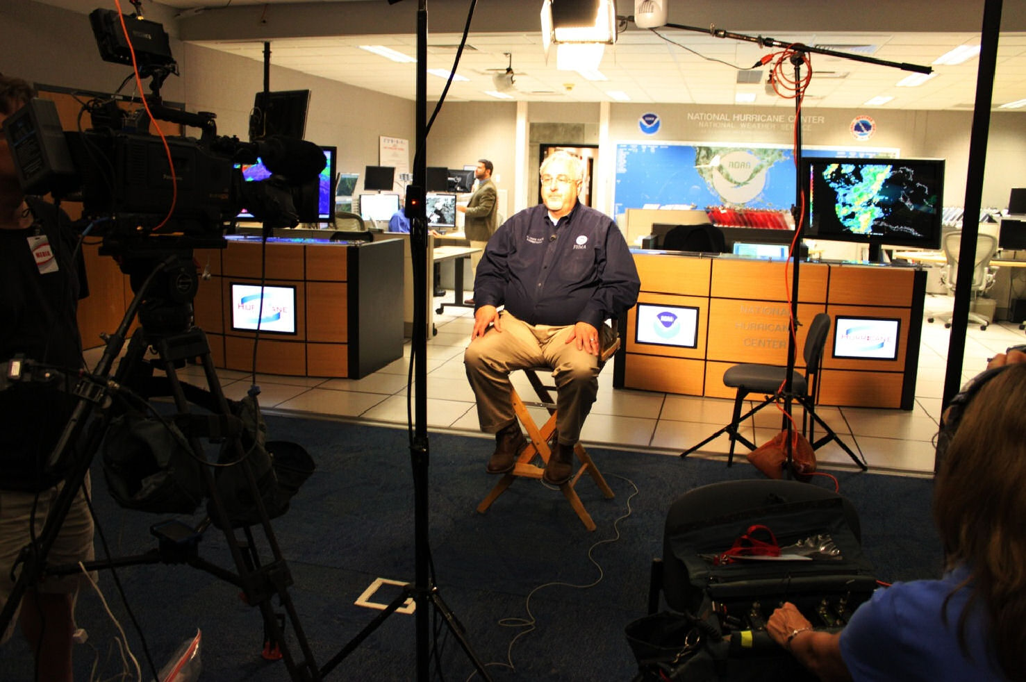 FEMA Administrator Craig Fugate prepares for a live television interview from NOAA's National Hurricane Center in Miami regarding the importance of having a hurricane plan.
