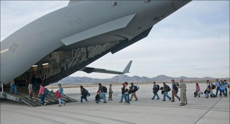 National Security Technologies scientists, technicians and engineers from the National Nuclear Security Administration’s Nevada Site Office board the Air Force C-17. Highly trained nuclear emergency response personnel and more than 17,000 lbs of hi-tech equipment were sent to Japan as part of the Department of Energy and National Nuclear Security Administration’s effort to assist Japanese personnel with nuclear issues. | Photo Courtesy NNSA News