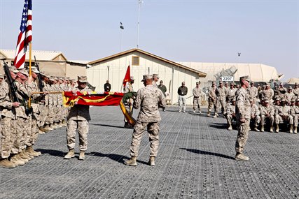 U.S. Marine Corps Col. Austin Renforth and Sgt. Maj. Scott Samuels unfold the regimental colors during the ceremony to transfer authority between Regimental Combat Team 6 and Regimetnal Combat Team 7 on Camp Leatherneck, Afghanistan, Oct. 25, 2012. Renforth is the commanding officer and Samuels is the sergeant major of Regimental Combat Team 7.